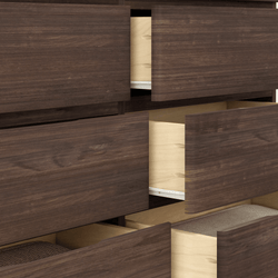 Open wooden dresser drawers in dark brown finish, perfect for bedroom storage solutions.