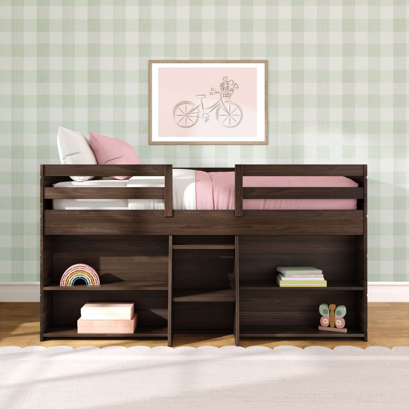 Loft bed with storage shelves in dark wood, pink bedding and pillows, pastel green gingham wallpaper, framed bicycle print and children's toys in a modern kids' bedroom