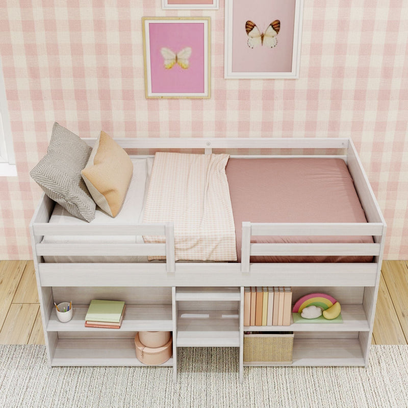 Children's loft bed with pink bedding, built-in storage shelves, and step ladder in a cozy, checkered print room with butterfly wall art.