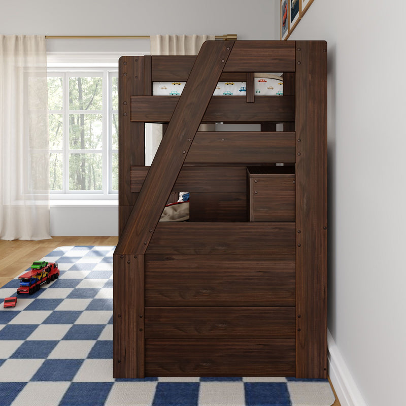 Dark wood bunk bed with angled ladder and storage drawers in children's bedroom, blue checkered rug, toy car hauler and car-print bedding by window with sheer curtains