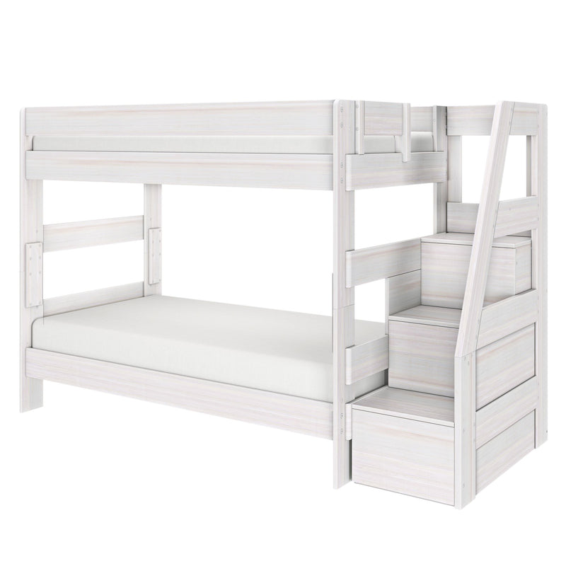 Whitewashed wooden twin-over-twin loft bunk bed with angled storage stairs, safety rails, and space-saving under-bed storage
