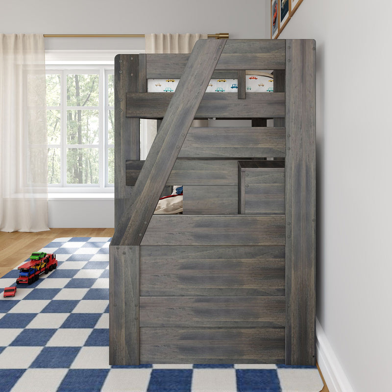 Gray wooden loft bunk bed with angled ladder in bright kids' bedroom, blue checkered rug and toy car truck, car-print bedding by a large window with sheer curtains