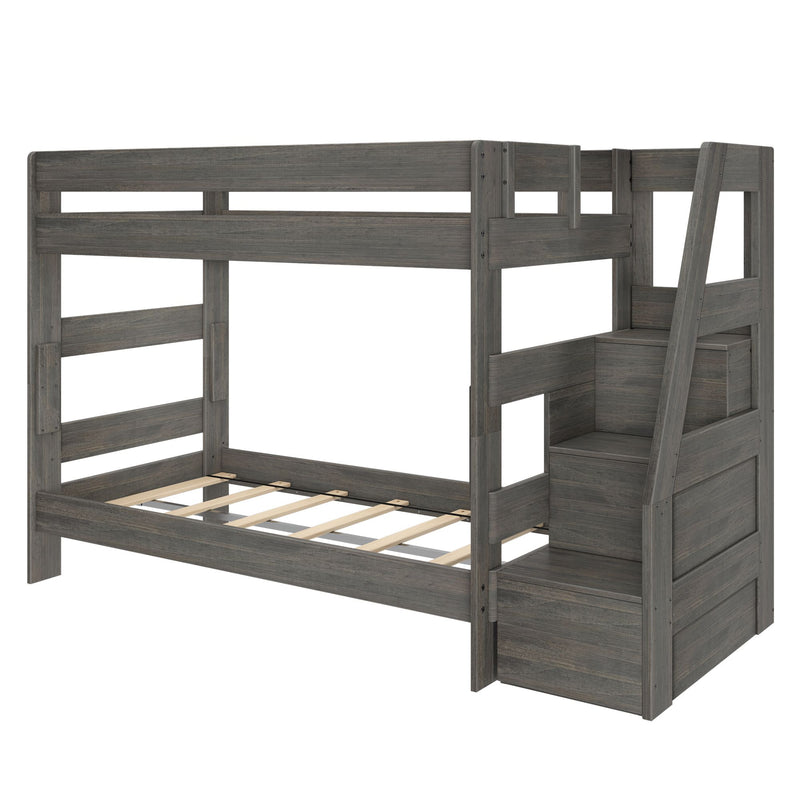 Gray wood twin-over-full bunk bed with built-in staircase storage and slatted mattress platforms