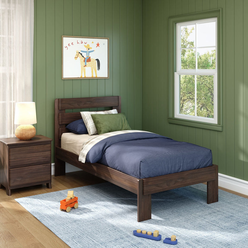 Kids bedroom with green shiplap walls, dark wood twin bed and nightstand, navy bedding, framed cowboy horse print, window and wooden toys