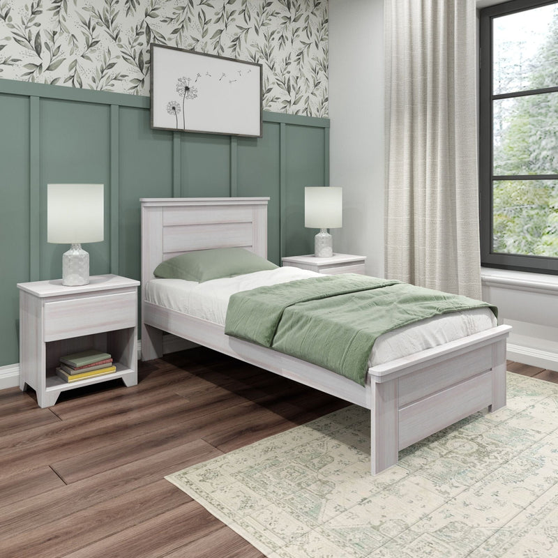 Cozy modern bedroom with sage green wainscoting and botanical wallpaper, white wooden bed with green bedding, matching nightstands and lamps, hardwood floor