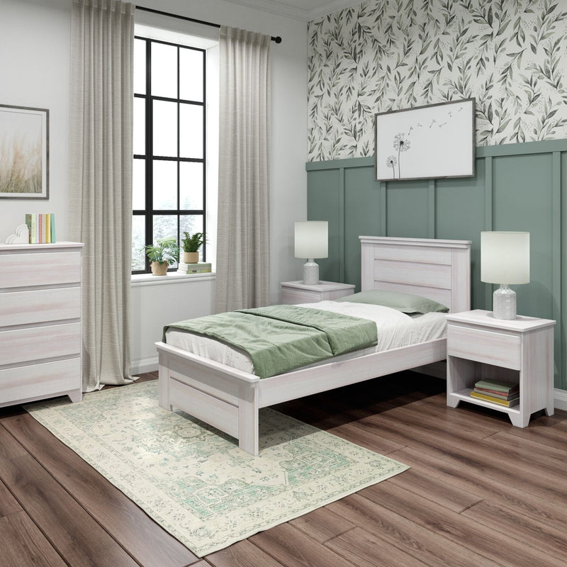 Modern bedroom with whitewashed wood bed, sage bedding, green board-and-batten wall and leaf wallpaper, black-framed window