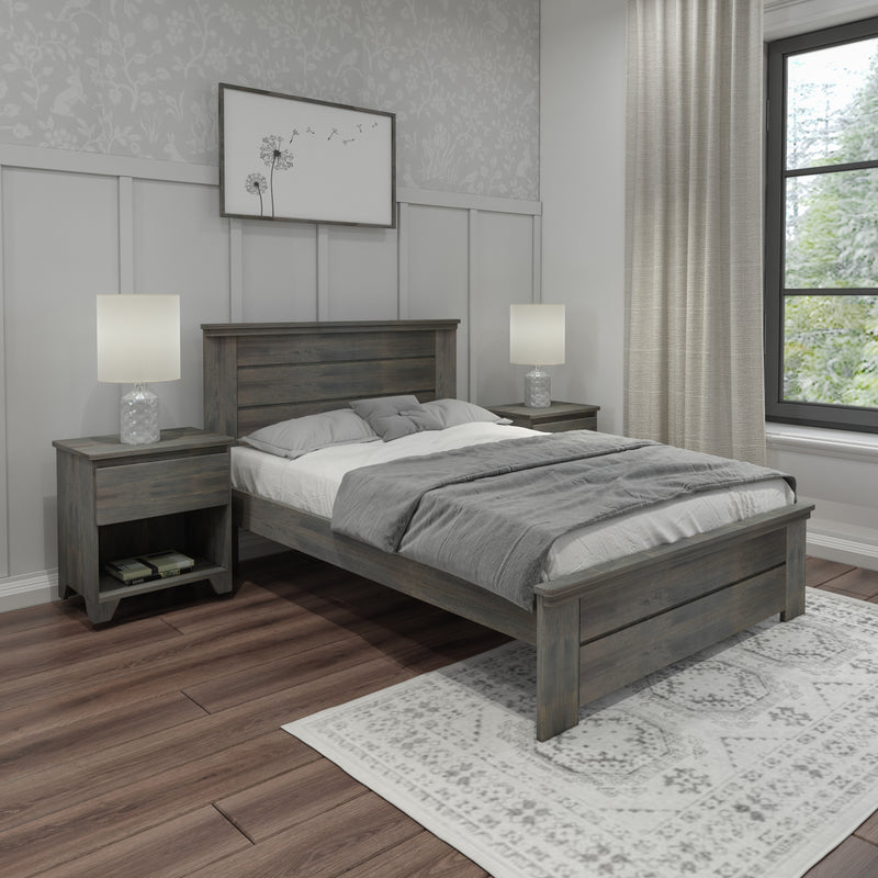 Modern farmhouse bedroom with gray wooden bed, matching nightstands, lamps, patterned wallpaper, hardwood floors