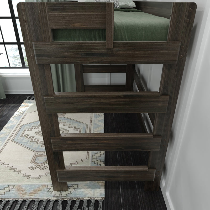 Dark brown wooden bunk bed ladder and guardrail with green bedding in a modern bedroom beside a window and patterned area rug