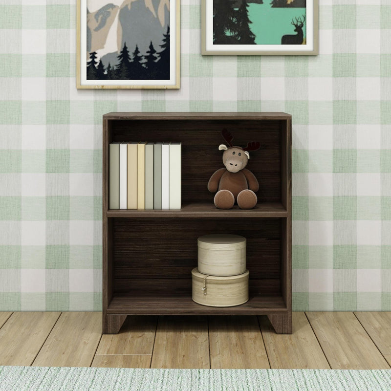 Wooden bookshelf with books, a stuffed moose toy, and decorative boxes against plaid wallpaper background.