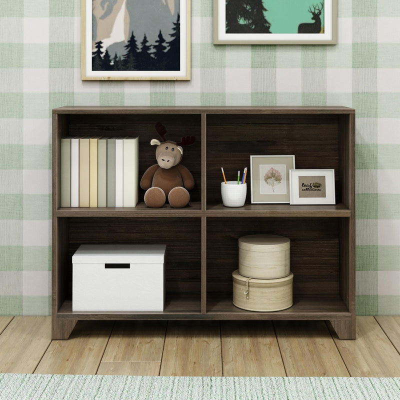 Modern wooden bookshelf with toys, books, storage boxes, and framed art in a children's room.