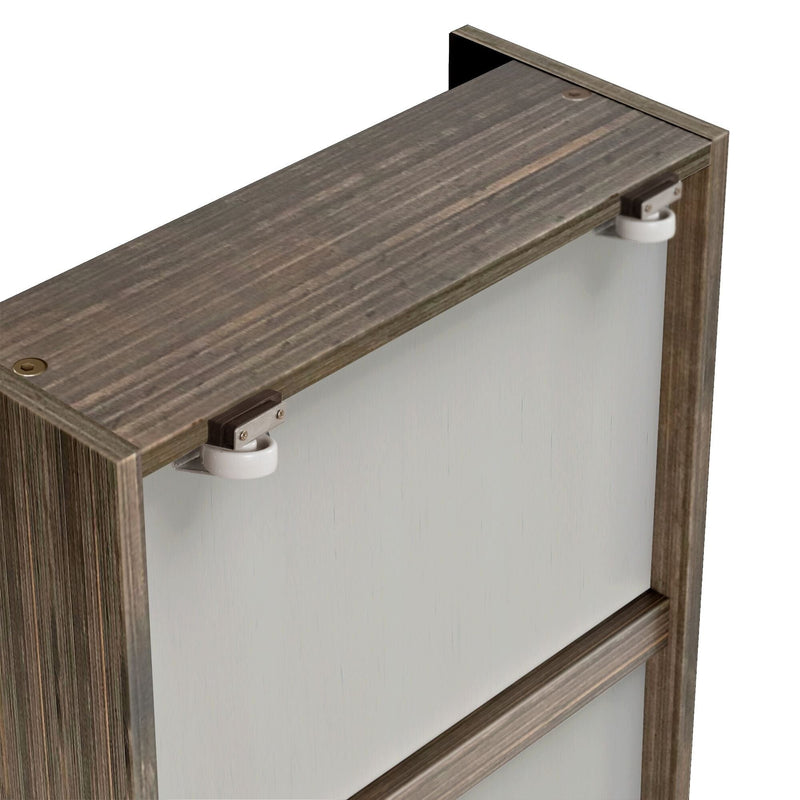 Close-up of weathered gray wood sliding door top corner showing white nylon roller hardware and metal brackets on reclaimed wood frame