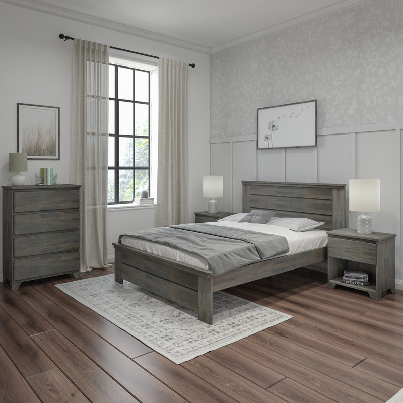 Modern farmhouse bedroom with gray wooden bed and nightstands, hardwood floors, patterned wallpaper accent wall, large window with sheer curtains and neutral bedding