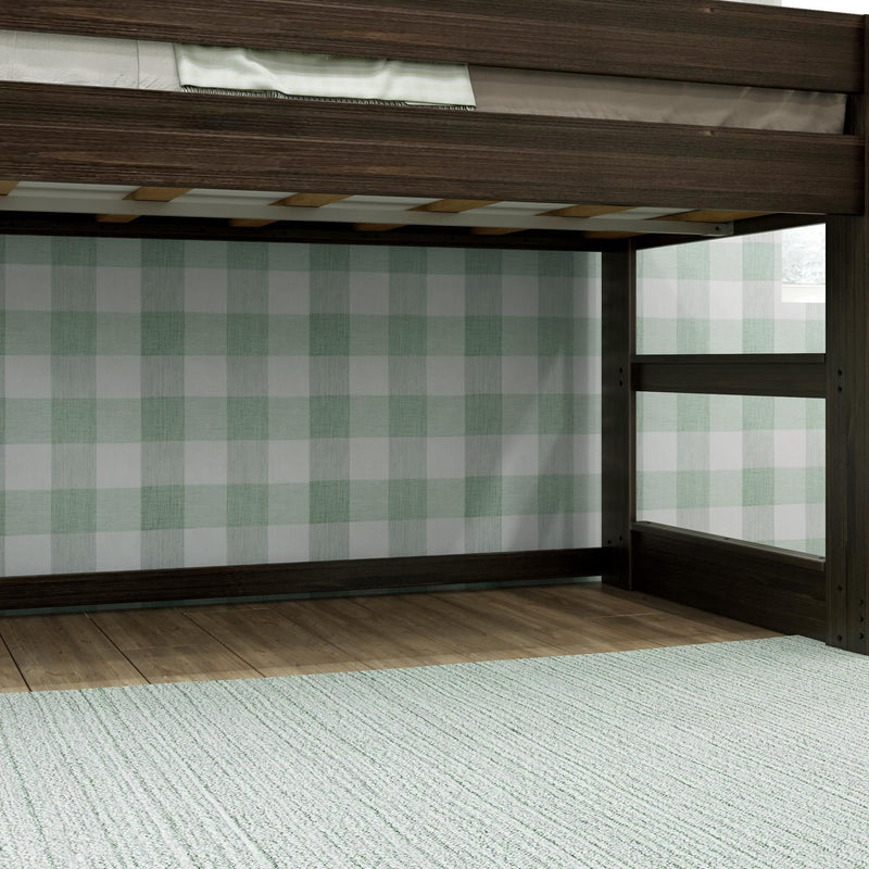 Dark wood bunk bed frame with ladder and slatted mattress support, light hardwood floor, green plaid wallpaper and textured area rug