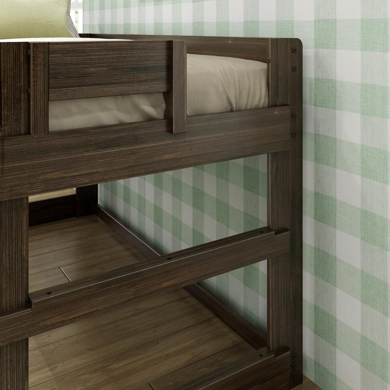 Dark wood bunk bed with guardrail and beige mattress against green plaid wallpaper in a hardwood-floored children's bedroom.