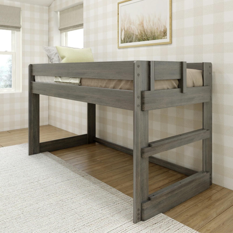Gray wood loft bed in a bright kids' bedroom with neutral plaid wallpaper, framed coastal artwork, pale green pillows, hardwood floors and a textured area rug — space-saving modern farmhouse decor.