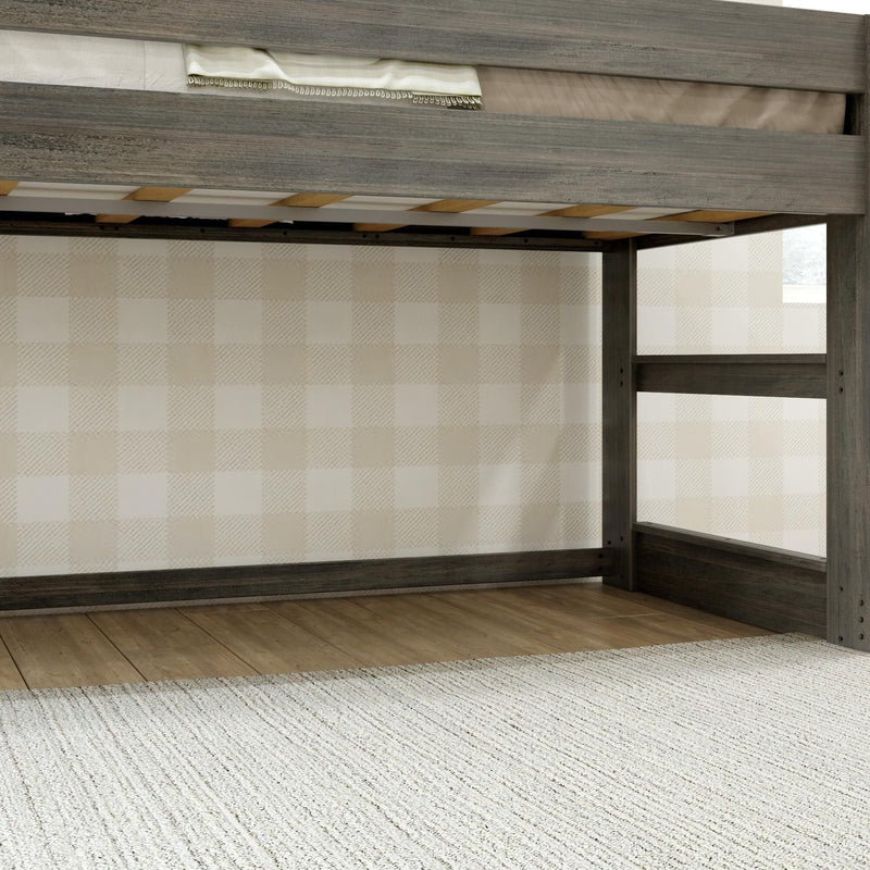 Gray weathered wood loft bed frame with ladder and slatted mattress platform above hardwood floor and neutral plaid wallpaper in children's bedroom
