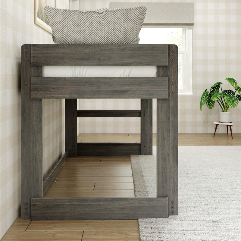Gray wooden loft bed frame in a modern farmhouse bedroom with a herringbone pillow, neutral plaid wallpaper, window with roman shade and potted monstera plant