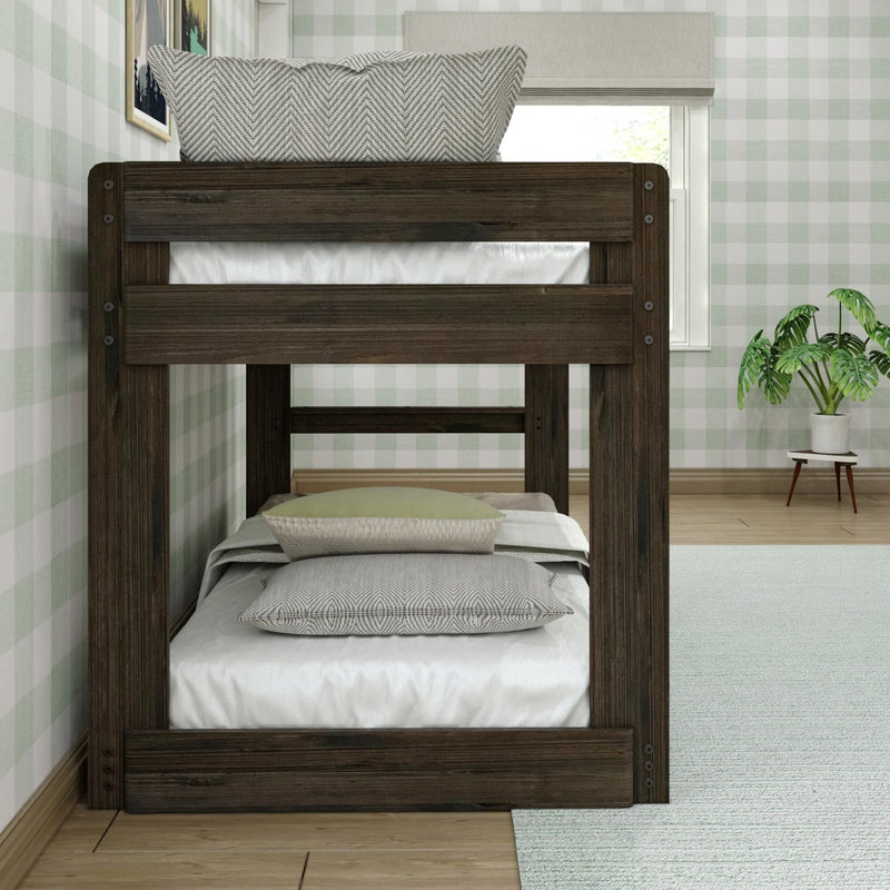Dark wooden bunk bed with chevron pillows in a cozy kids bedroom, green plaid wallpaper, white bedding and potted plant