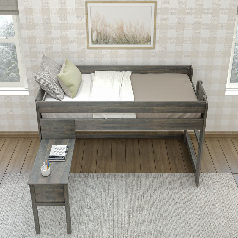 Top-down view of a rustic wooden loft twin bed with neutral bedding and decorative pillows, built-in desk with notebooks and pencil cup, plaid wallpaper and framed botanical art in a cozy farmhouse bedroom