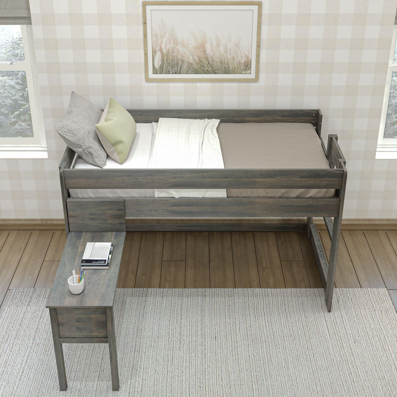 Top-down view of a rustic wooden loft twin bed with neutral bedding and decorative pillows, built-in desk with notebooks and pencil cup, plaid wallpaper and framed botanical art in a cozy farmhouse bedroom