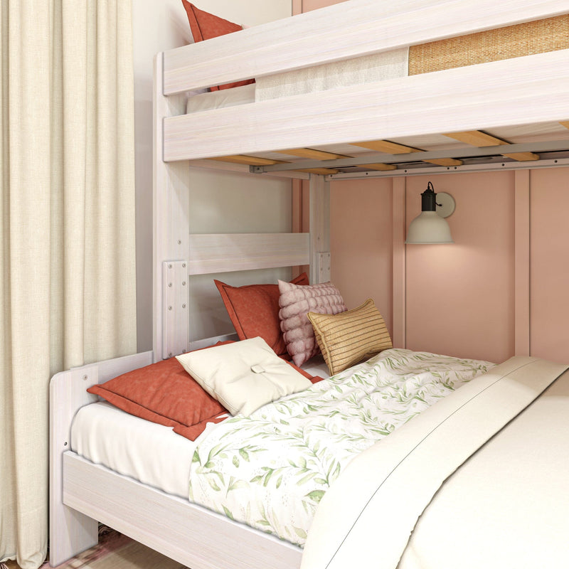 Light wood loft bunk bed with coral pillows and floral duvet in a cozy kids' bedroom reading nook with wall lamp