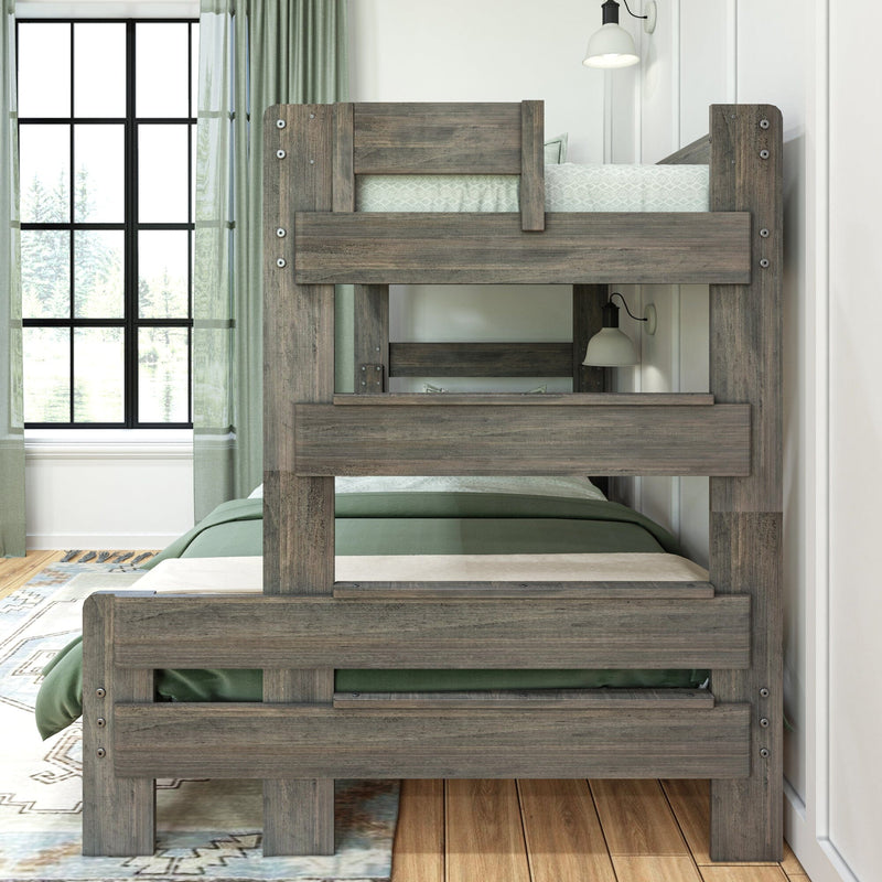 Rustic gray solid wood twin bunk bed with green bedding in a bright bedroom featuring a black grid window, sage curtains, wall lamp and hardwood floors