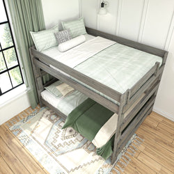 Wooden bunk bed with green bedding in a bright room featuring a patterned rug and window curtains.