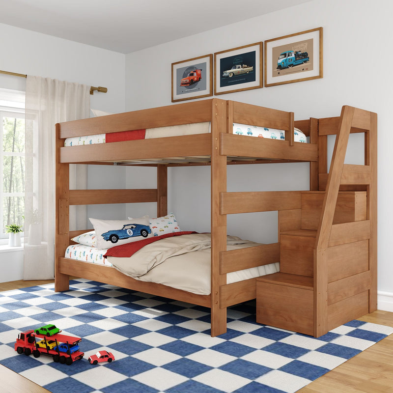 Wooden kids bunk bed with car-themed bedding and toy cars, stair storage, framed car prints and blue check rug in a bright children's bedroom