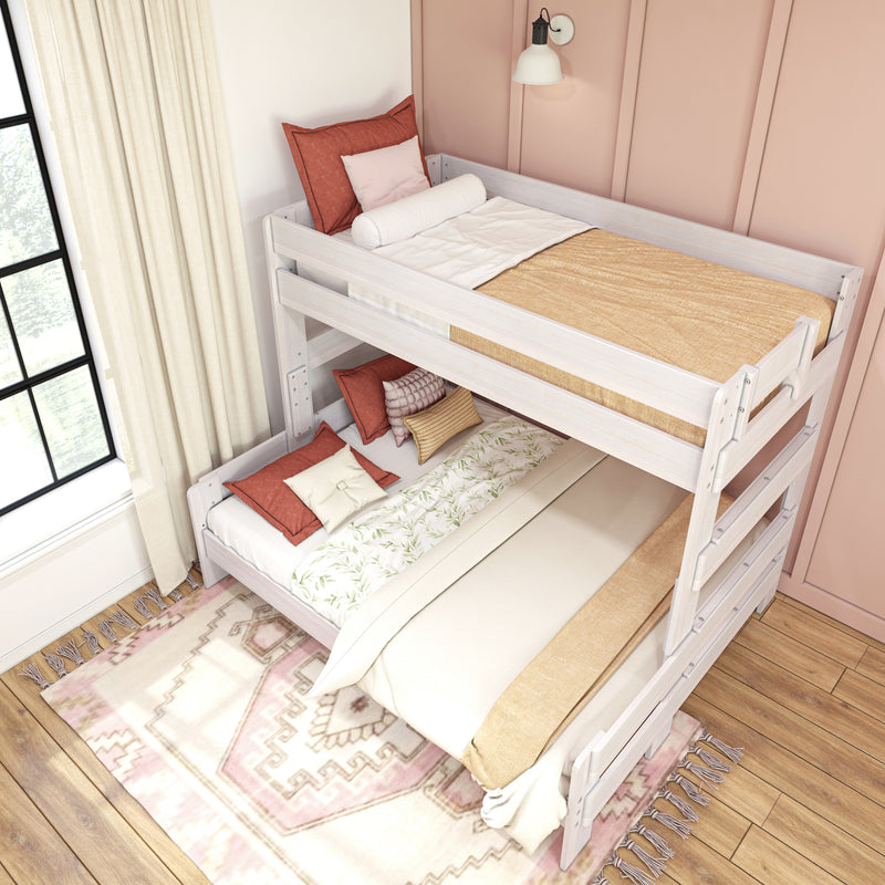 White wooden bunk bed for kids in a cozy pink children's bedroom with beige bedding, terracotta pillows, patterned rug and sunlit window