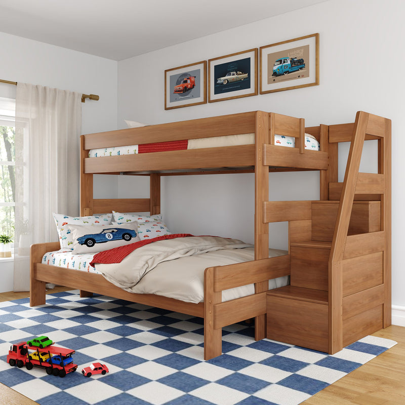 Natural wood bunk bed with built-in stairs and storage in a kids' bedroom, car-themed bedding and framed car prints, toy cars on a blue checkered rug