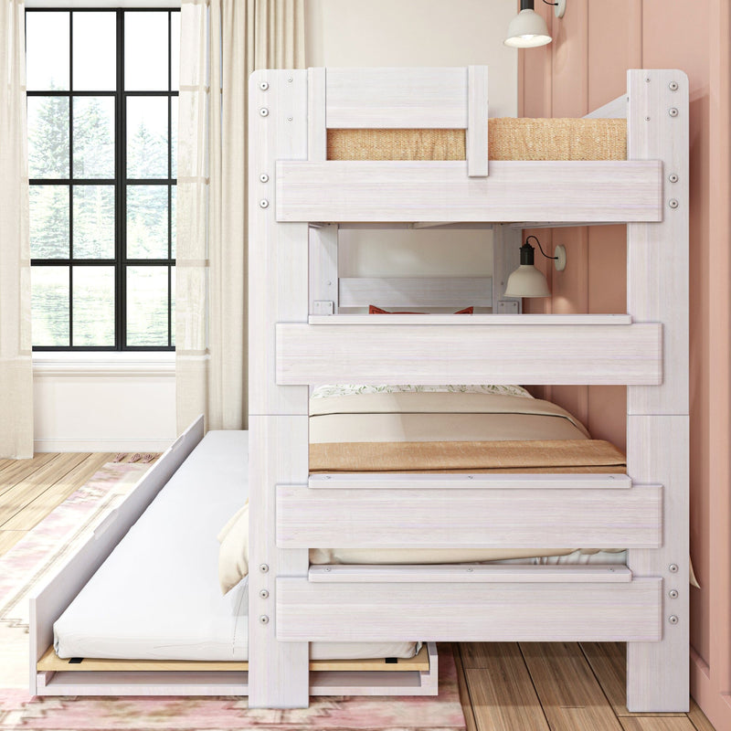 Whitewashed wooden bunk bed with pull-out trundle in bright kids bedroom with neutral bedding, sheer curtains, black grid window and pink accent wall