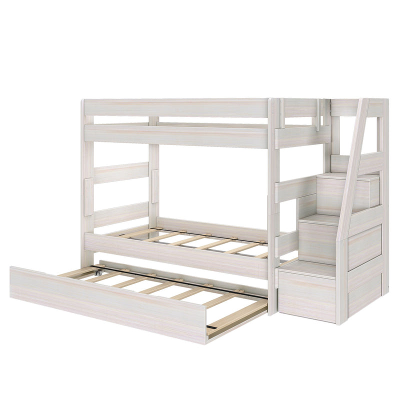 Whitewashed wooden bunk bed with pull-out trundle, built-in storage staircase and slatted frame — space-saving kids' bedroom loft bed