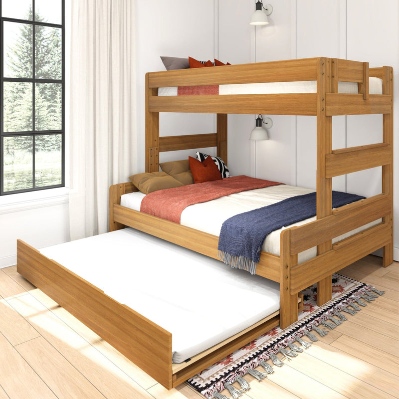 Solid wood twin-over-twin bunk bed with pull-out trundle and cozy bedding in modern kids' bedroom