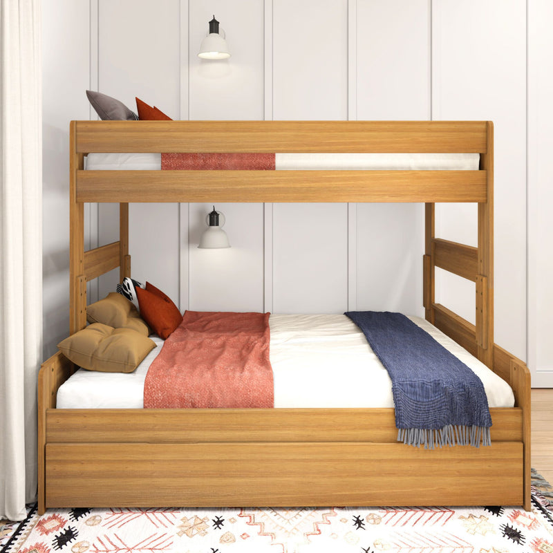 Modern natural wood bunk bed with white paneled wall, rust and navy bedding, throw pillows, wall sconces and patterned boho rug in a cozy children's bedroom