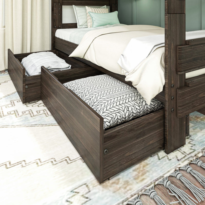 Dark wood bunk bed with pull-out trundle storage drawers, twin mattresses with cream bedding and mint green pillows on patterned rug