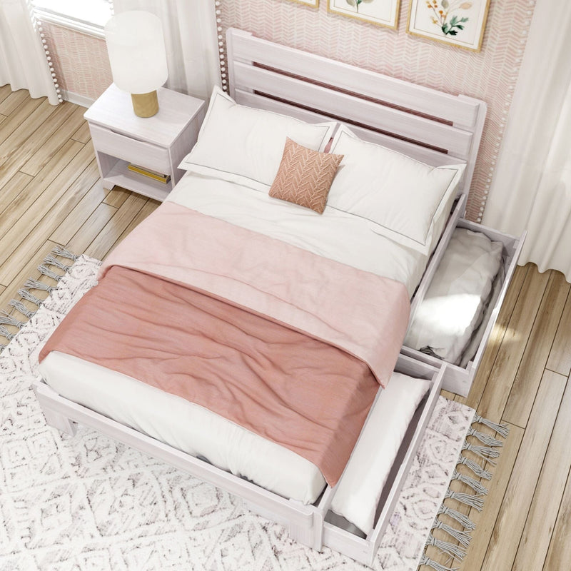 Top-down view of blush bedroom with white wooden platform storage bed (under-bed drawers), pink duvet, textured throw pillow and white nightstand lamp