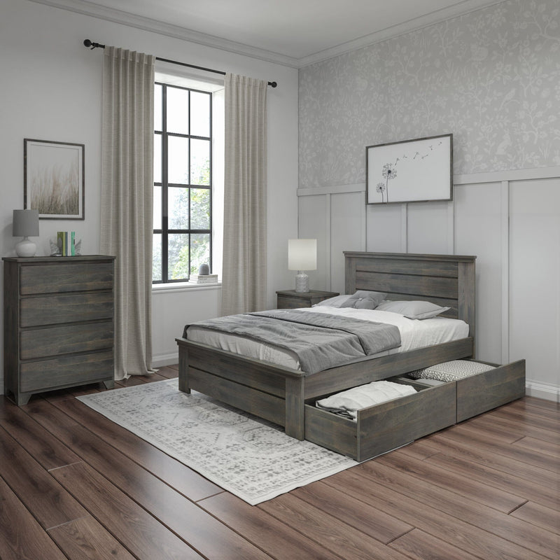Modern farmhouse bedroom with gray reclaimed-wood bed and dresser, under-bed storage drawers open, neutral bedding, patterned rug, large window with beige curtains, floral accent wallpaper and bedside lamps