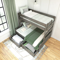 Modern wooden bunk bed with storage drawers, green bedding, and decorative pillows in a bright, cozy bedroom setting.
