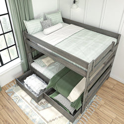 Wooden bunk bed with green bedding and storage drawers in a cozy bedroom setting.