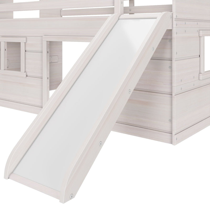 White wooden kids loft bed with integrated slide and ladder, close-up of modern children's bunk bed playhouse detailing