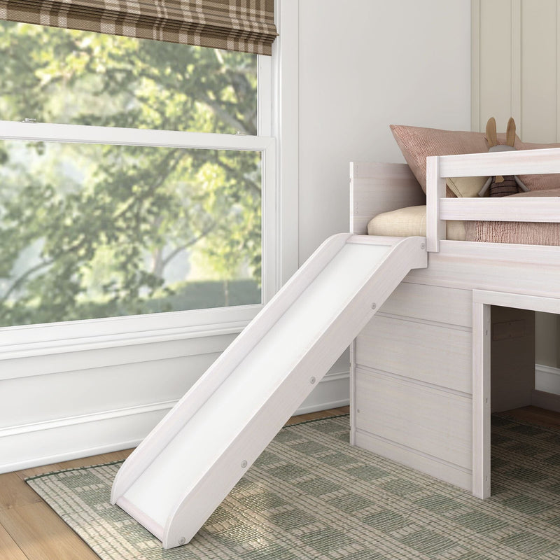 White wooden kids loft bed with slide, blush pillows and bunny plush beside a large window with plaid Roman shade in a bright neutral bedroom