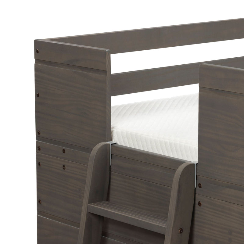 Close-up of gray stained wooden bunk bed ladder and safety guardrail with white mattress