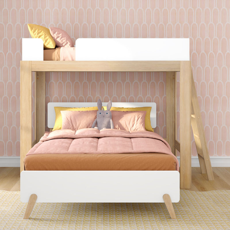 Scandi wooden loft bunk bed with pink bedding, yellow accent pillows and stuffed bunny against pastel arch wallpaper in kids' room
