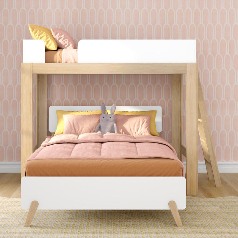 Scandi wooden loft bunk bed with pink bedding, yellow accent pillows and stuffed bunny against pastel arch wallpaper in kids' room