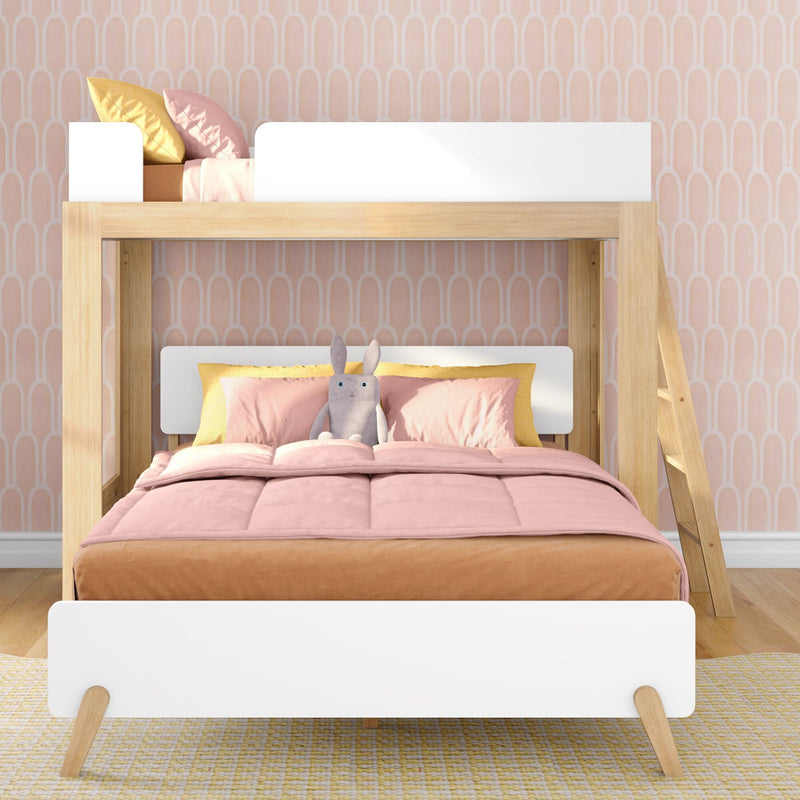 Wooden loft bunk bed in a pastel pink kids bedroom with soft pink and yellow bedding, plush rabbit toy, ladder and arch-patterned wallpaper