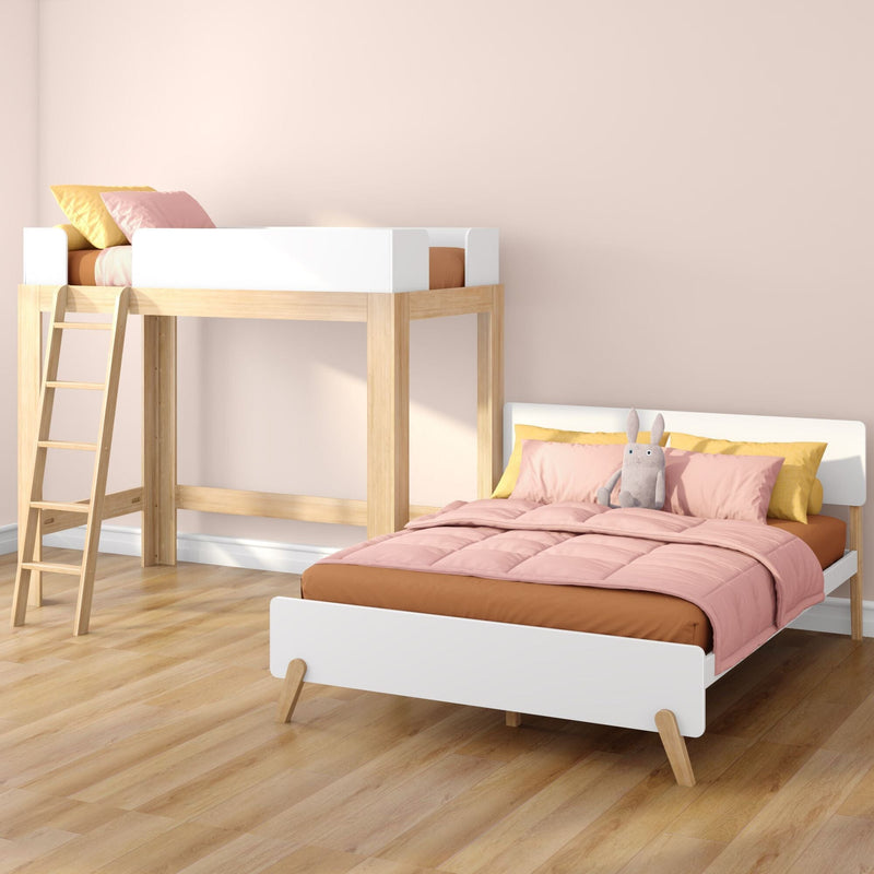Modern wooden loft bunk bed with ladder in pastel kids' bedroom, pink and yellow bedding and plush bunny for cozy children's decor