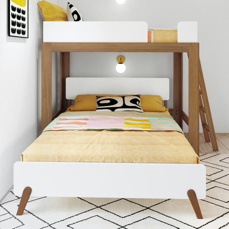 Modern wooden bunk bed with white guardrails, yellow bedding and patterned throw in Scandinavian-style kids' bedroom with ladder and geometric rug
