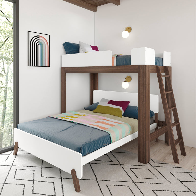 Modern walnut bunk bed with white guardrails and ladder, teal bedding and colorful pillows, pastel striped throw, wall sconces and geometric rug in bright kids' bedroom