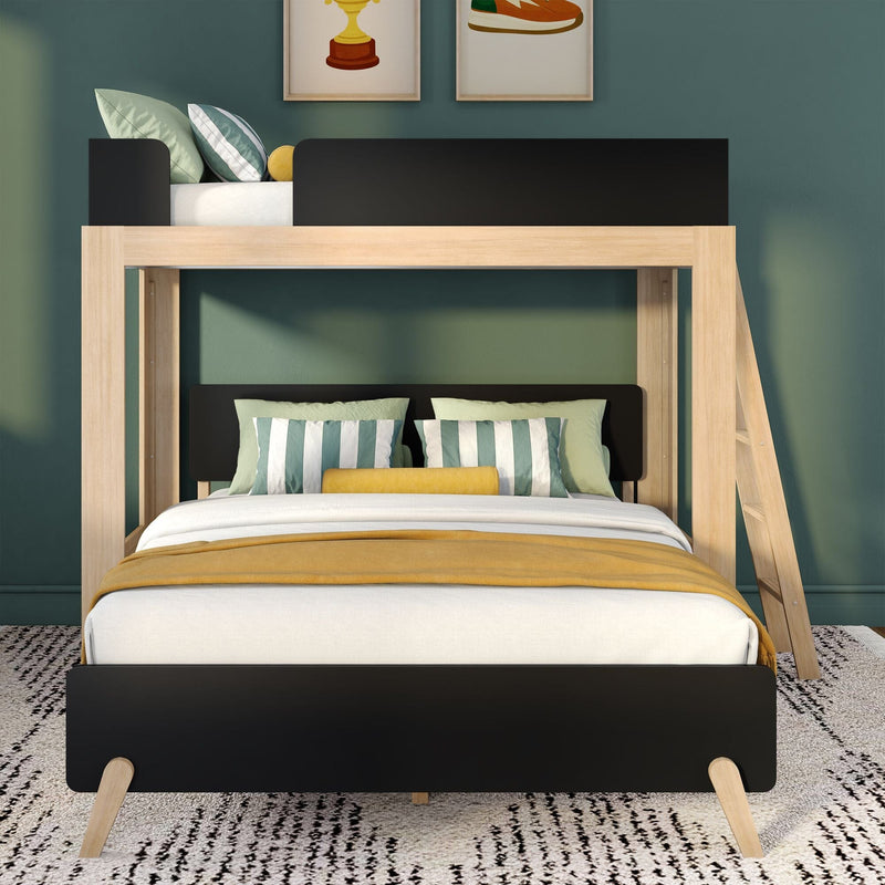 Modern wooden loft bunk bed with black guardrails, teal-striped pillows and mustard yellow throw on green accent wall — kids' bedroom decor
