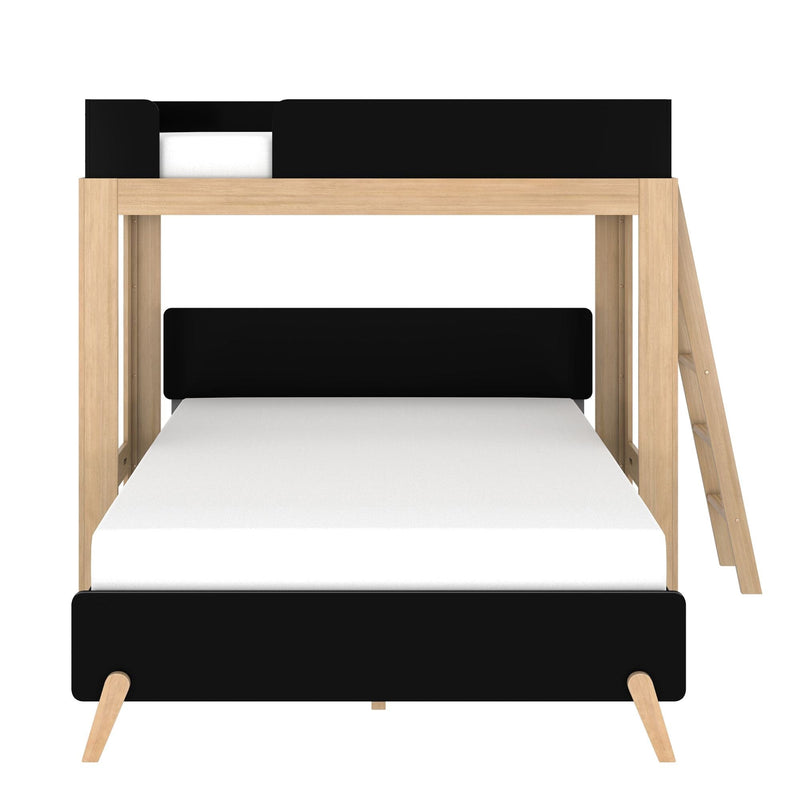 Scandinavian-style natural oak twin bunk bed with black safety rails and angled ladder, white mattress on lower bunk